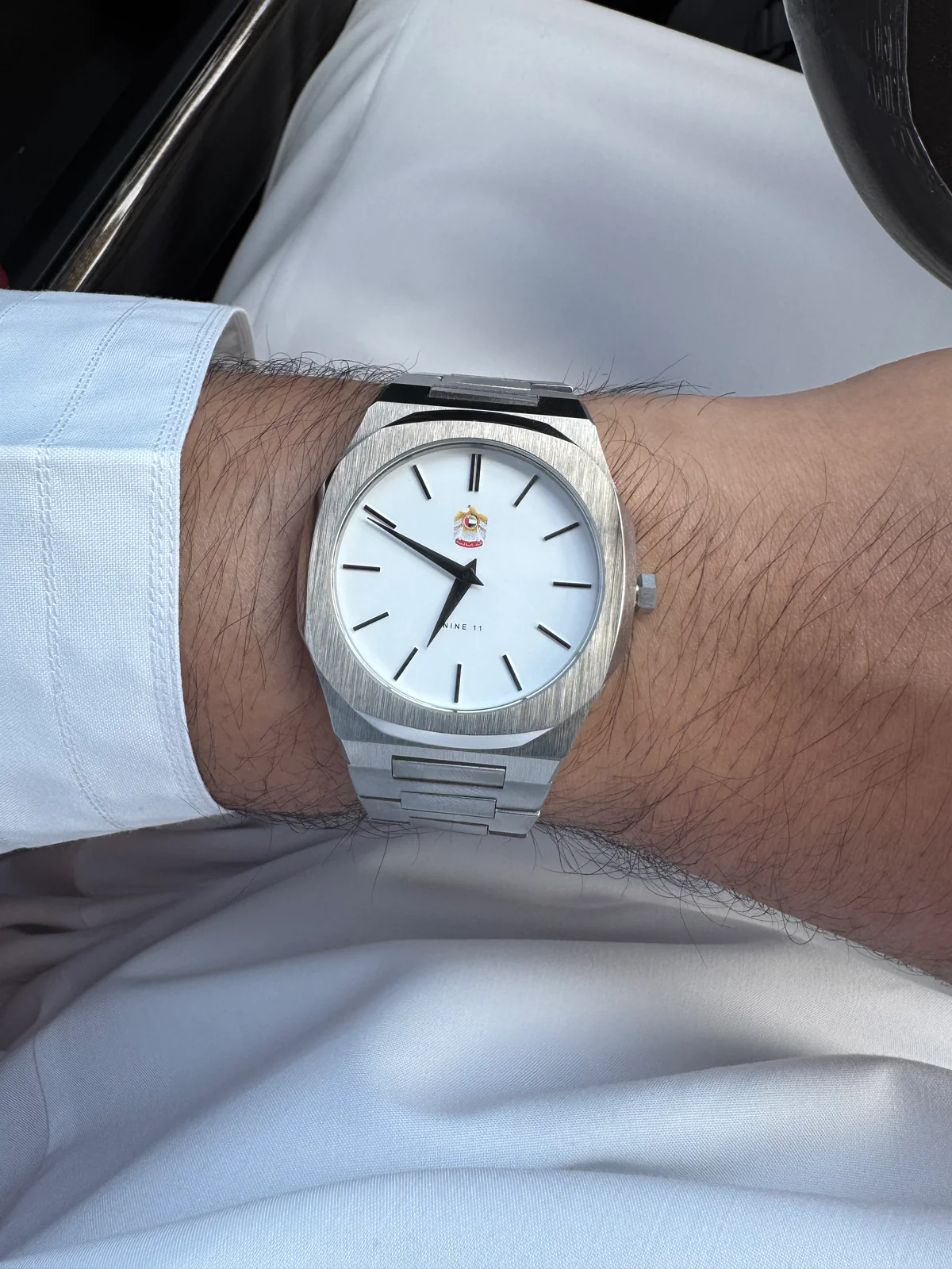 On the wrist — white cuff