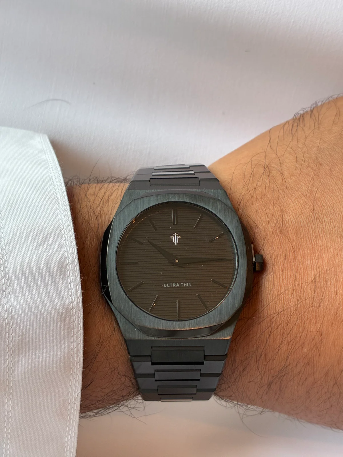 On the wrist — white cuff